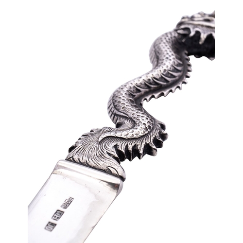 245 - A late 19th century Chinese export silver paperknife by Wang Hing & Co, with cast serpent dragon han... 