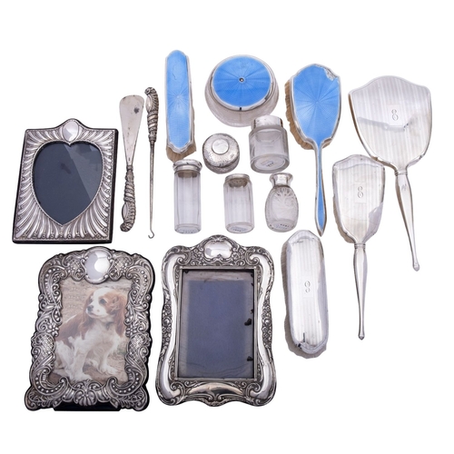 25 - A group of silver items comprising: a cased pair of silver handled shoe horn and button hook, makers... 