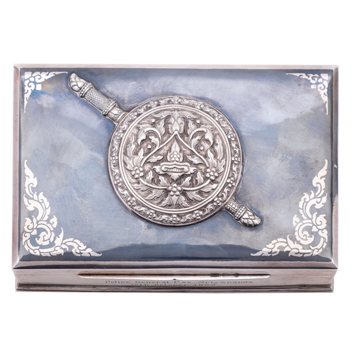 253 - A mid 20th century Thai silver cigarette box makers mark rubbed, niello ware decoration with applied... 