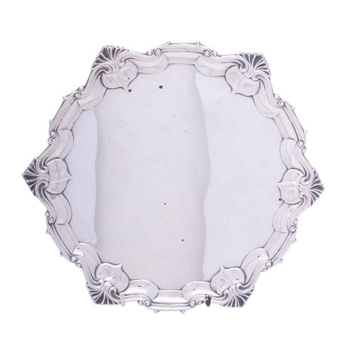 321 - An Edward VII silver salver by William Hutton & Son, London 1903, of circular form with shell and sc... 