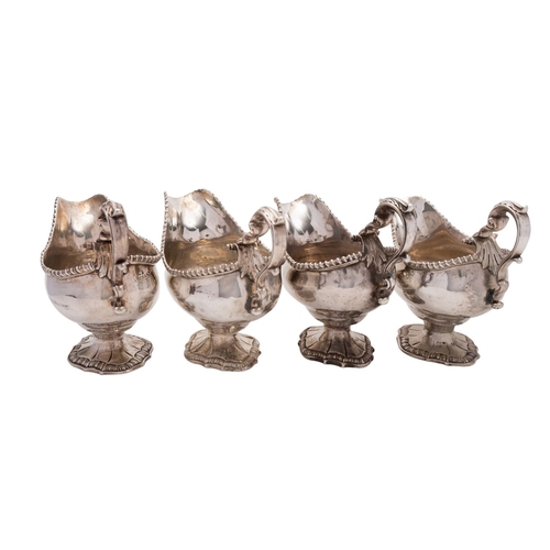 332 - A pair of George III silver sauce boats by William Skeen, London 1765, baluster bodies with gadroone... 