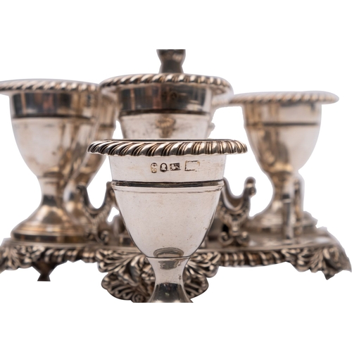 345 - A late George III silver hexafoil egg stand by Smith, Tate & Co., Sheffield 1819, the central foliat... 