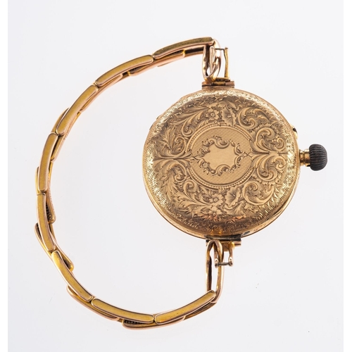 371 - A ladies foliate engraved open faced pocket watch, gilt flower dial and Roman numeral markers, marke... 