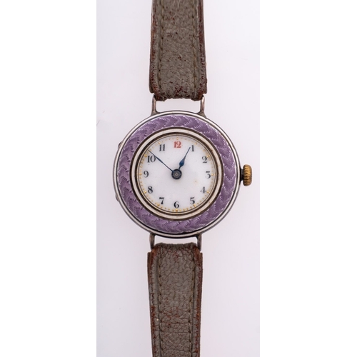 401 - An Edwardian purple enamel and silver lady's wristwatch the round dial with black Arabic numerals an... 