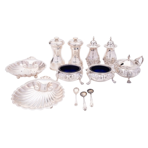 45 - A group of silver items comprising: a matched five-piece cruet set, a mustards and  two pepperettes ... 