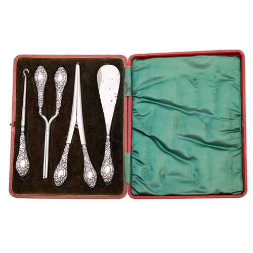 49 - A group of silver items to include; a cased silver handled dressing table set, a pair of steel and s... 