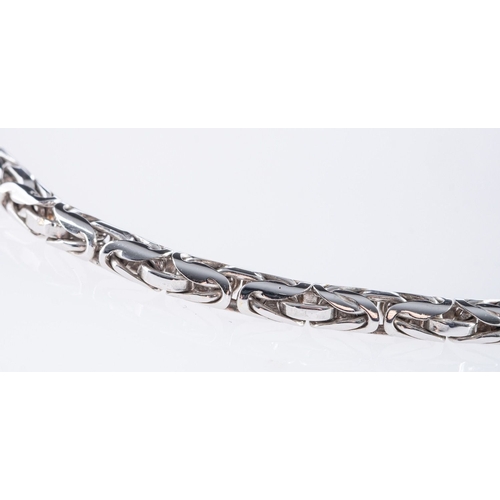 501 - A fancy-link necklace, marked 585, length 43.50cm and a matching fancy-link bracelet, marked 585, le... 