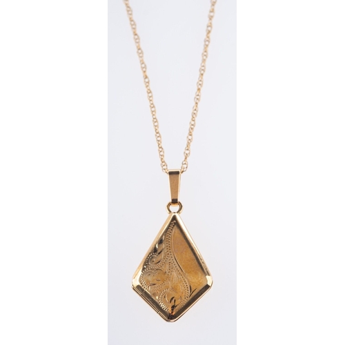 507 - A 9ct yellow gold locket pendant, of 'kite' shape with foliate engraving, measuring 2.70cm x 1.30cm,... 