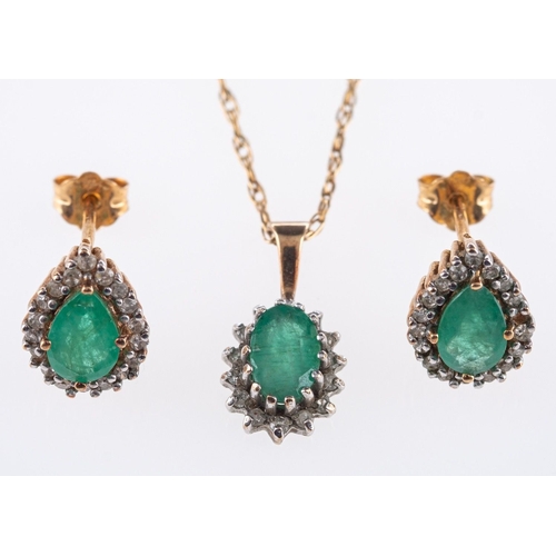 545 - An emerald and diamond necklace and earrings, the pendant of cluster design set with an oval-cut eme... 