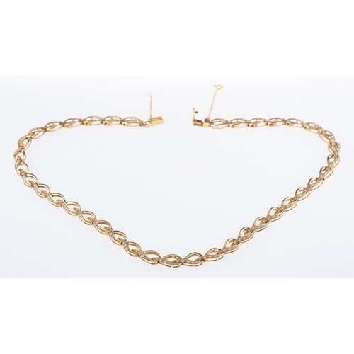 547 - A 9ct yellow gold oval link necklace, of open interlocking oval links each set with four circular-cu... 