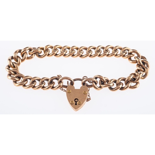 555 - A 9ct yellow gold curb bracelet, with heart padlock and safety chain, marked 9ct, 13.9grams.