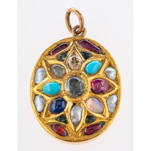 564 - An ornate oval designed pendant, set with a mixture of cabochon cut semi-precious gemstones and pear... 