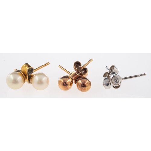 581 - Three pairs of stud earrings, a pair of diamond set studs, diamonds approx. 0.20 carat total, marked... 