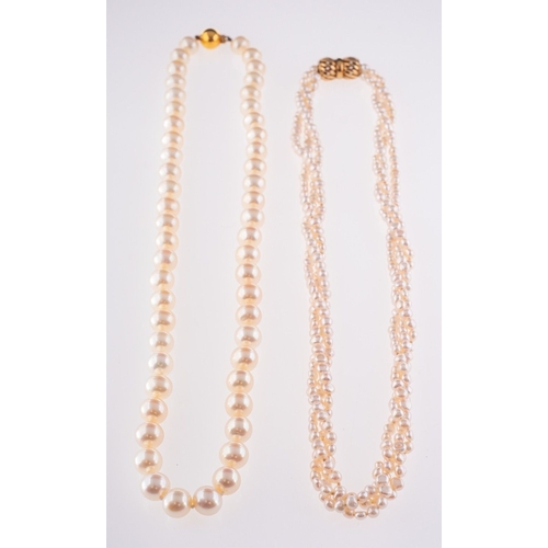 582 - Two strands of pearls, a twisted three-strand necklace of small pearls to an openwork twist design c... 