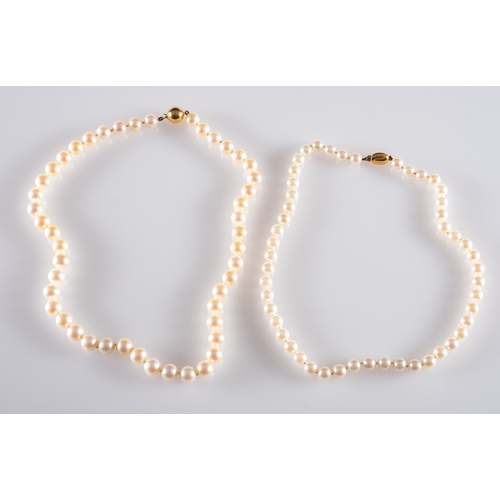 583 - Two strands of pearls, a single strand of cultured pearls, 8.5mm to 9mm, to a ball clasp, marked 9ct... 