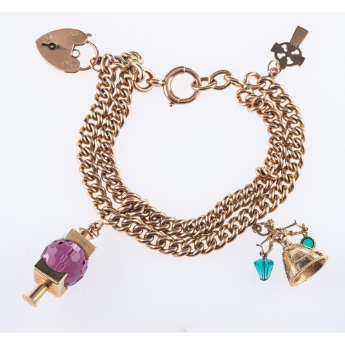 584 - A charm bracelet with three charms, a double-row curb bracelet with heart padlock, links and heart p... 