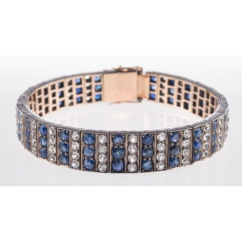 585 - A blue and white sapphire bracelet, of articulated design and set with alternating rows of circular-... 