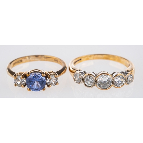 819 - Two 9ct yellow gold rings, a three stone ring set with circular-cut blue and white paste stones, UK ... 