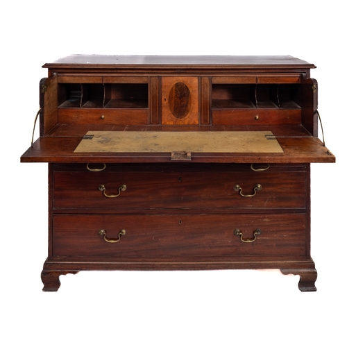 161 - A George III mahogany secretaire chest, circa 1810, the top with a moulded edge, having a fall enclo... 