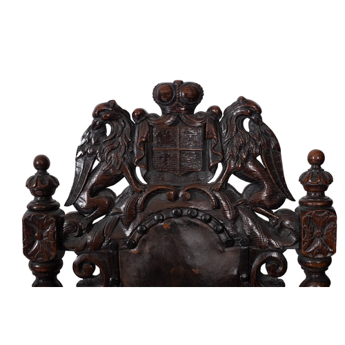 169 - A set of four Victorian carved oak and leather upholstered side chairs in Charles II style, late 19t... 