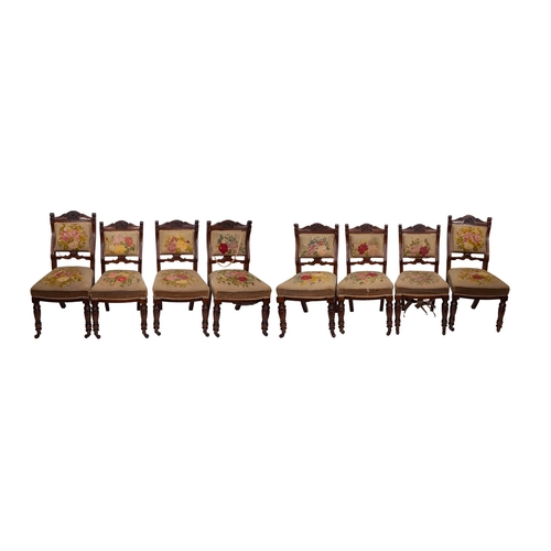 191 - A set of eight late 19th Century walnut dining chairs, circa 1890, with gros-point floral needlework... 