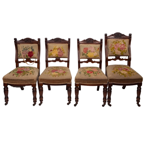 191 - A set of eight late 19th Century walnut dining chairs, circa 1890, with gros-point floral needlework... 