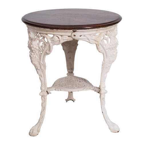 198 - A Victorian painted cast iron circular conservatory table with a later stained wood moulded top, on ... 