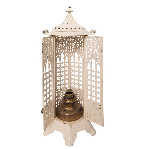 201 - A late Victorian cast iron and later cream painted hexagonal room heater, with cover and brass twin ... 