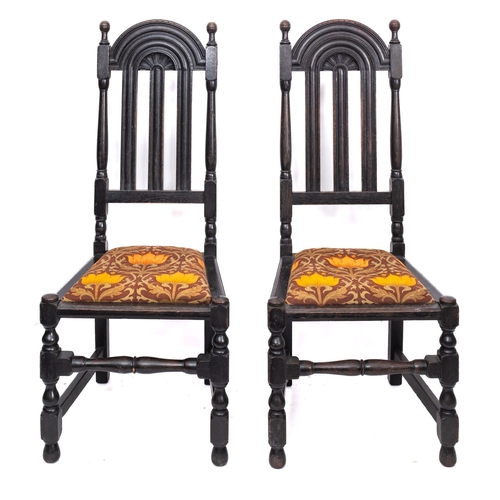 206 - A pair of carved oak side chairs in Charles II style, circa 1900, with domed arch backs and upholste... 