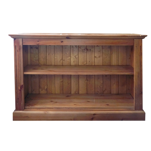 216 - A pair of pine low open bookcases, 20th Century, each with adjustable shelves on a plinth base, 122c... 