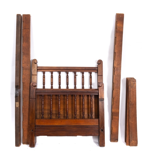 227 - An Edwardian walnut single bed, early 20th Century, with turned uprights to head and footboard, comp... 