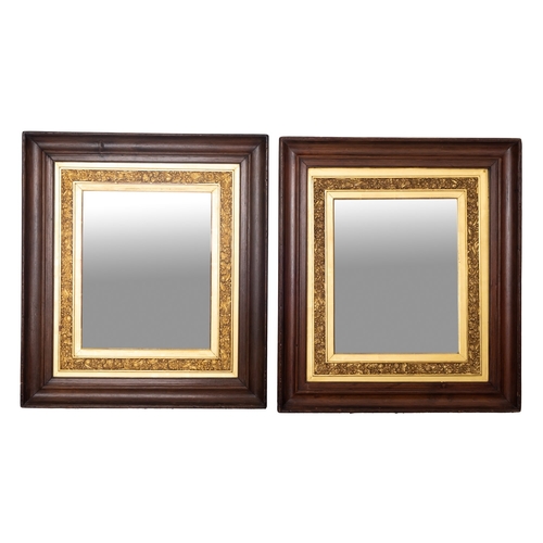 231 - A pair of Edwardian stained wood and partly gilt rectangular mirrors, the plates within gilt moulded... 