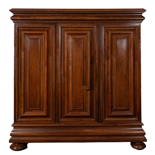 240 - A walnut Hallenschrank, late 19th Century, in 17th Century style, with moulded ogee corners, the fit... 