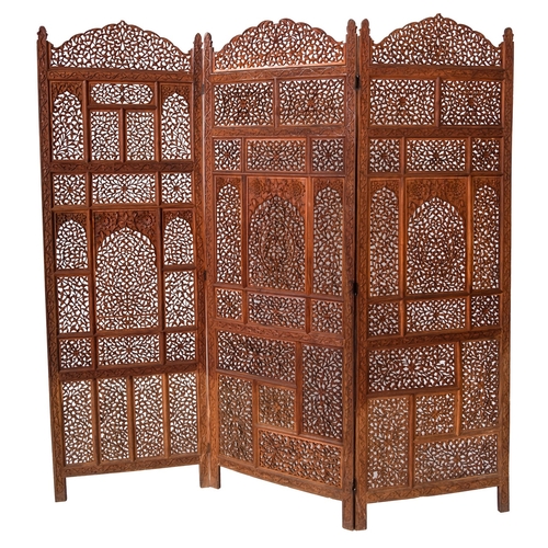 246 - An Anglo Indian carved and stained hardwood three-fold room screen, early 20th Century, with openwor... 