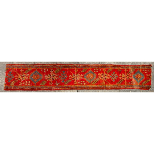 265 - A Turkey runner of traditional design and colours with five geometric medallions, 342cm x 90cm, toge... 