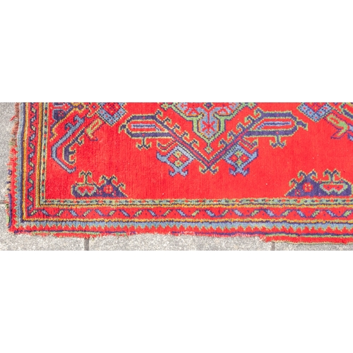 265 - A Turkey runner of traditional design and colours with five geometric medallions, 342cm x 90cm, toge... 