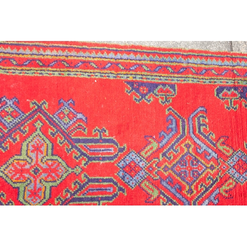 265 - A Turkey runner of traditional design and colours with five geometric medallions, 342cm x 90cm, toge... 