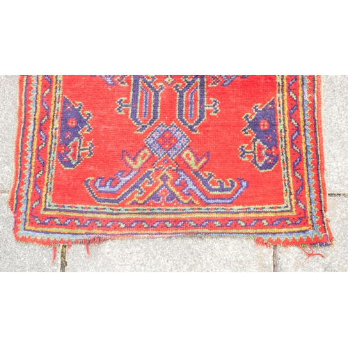 265 - A Turkey runner of traditional design and colours with five geometric medallions, 342cm x 90cm, toge... 