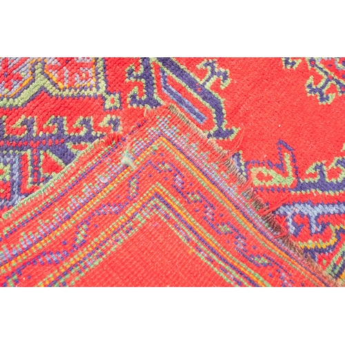 265 - A Turkey runner of traditional design and colours with five geometric medallions, 342cm x 90cm, toge... 