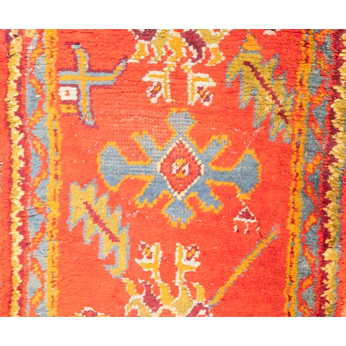 265 - A Turkey runner of traditional design and colours with five geometric medallions, 342cm x 90cm, toge... 