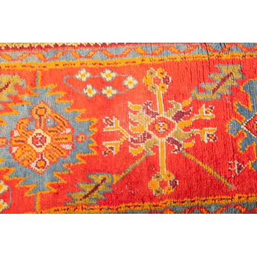 265 - A Turkey runner of traditional design and colours with five geometric medallions, 342cm x 90cm, toge... 