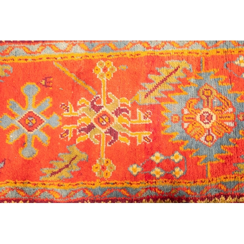 265 - A Turkey runner of traditional design and colours with five geometric medallions, 342cm x 90cm, toge... 