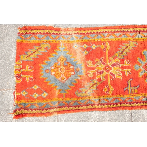 265 - A Turkey runner of traditional design and colours with five geometric medallions, 342cm x 90cm, toge... 