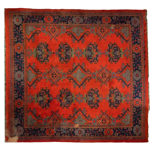 267 - A Turkey carpet with traditional design and colours, 336cm x 330cm (damaged)