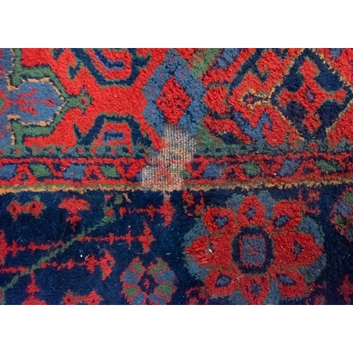 267 - A Turkey carpet with traditional design and colours, 336cm x 330cm (damaged)