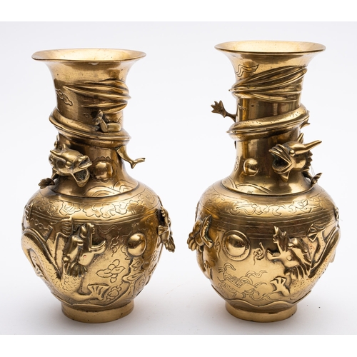 313 - A pair of Chinese brass vases with raised decoration of dragons, the bulbous bases with character ma... 