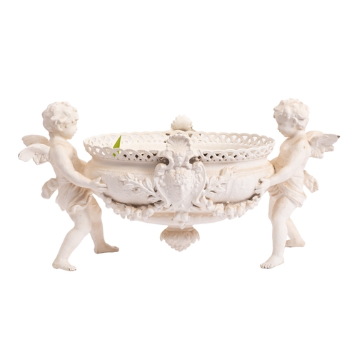 316 - A painted metal table jardinière in Parian style modelled as two amorini holding an oval basket betw... 