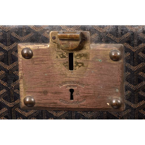 317 - MALLES GOYARD.. A canvas, leather bound and brass mounted steamer trunk with hinged top and front en... 