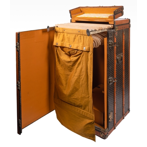 317 - MALLES GOYARD.. A canvas, leather bound and brass mounted steamer trunk with hinged top and front en... 