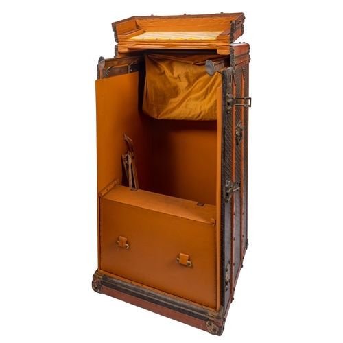 317 - MALLES GOYARD.. A canvas, leather bound and brass mounted steamer trunk with hinged top and front en... 